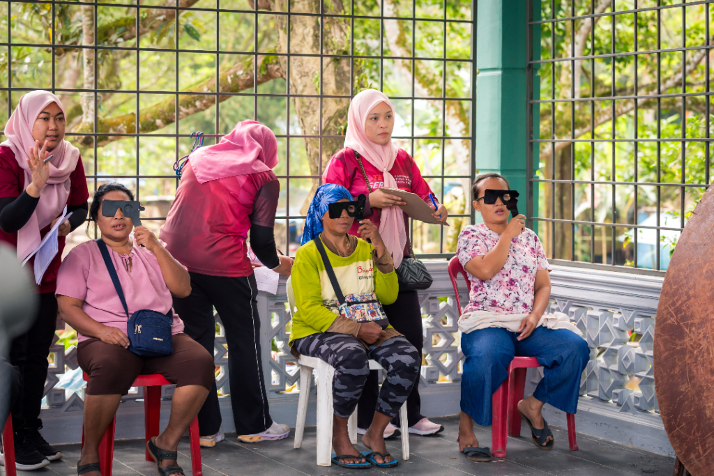 Optometrist from Top One Optical conducting eye care screenings in collaboration with members from The Tribe Project for the residents in Hulu Langat
